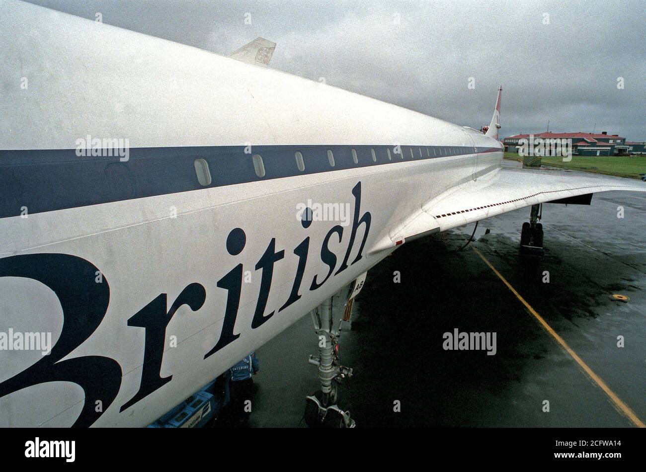 1977 - A view from the top of the boarding ladder of the left side, wing and tail section of a British Airways Concorde aircraft parked on the flight line.  The aircraft is on an around-the-world test flight. Stock Photo