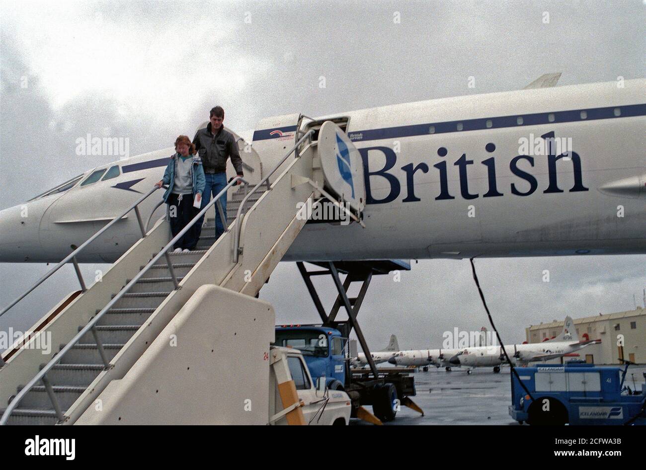 Concorde Rear Exits 1977 - Two passengers exit a British Airways Concorde aircraft parked ...