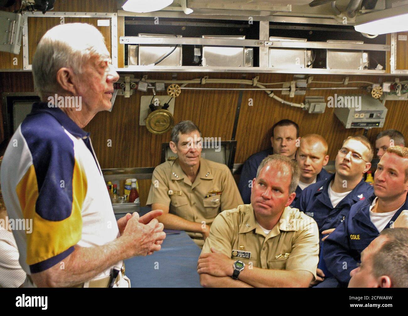 2005 - Former US President James E. Carter addresses the crew onboard his namesake ship, the Sea Wolf Class Attack Submarine USS JIMMY CARTER (SSN 23) in the crew's mess. President Carter and his wife, Rosalynn, spent the night aboard the submarine, touring the ship and meeting with crew members. The USS JIMMY CARTER is the third in Sea Wolf Class Attack Submarine. Stock Photo