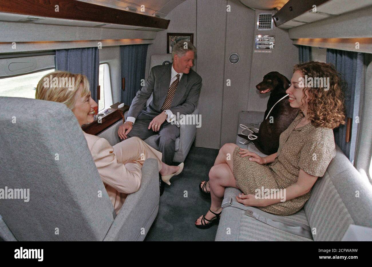 7/24/1998 Photograph of President William Jefferson Clinton, First Lady Hillary Rodham Clinton, Chelsea Clinton, and Buddy the Dog Sitting in Marine One Stock Photo