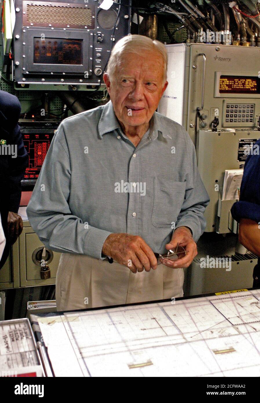 2005 - Former US President Jimmy Carter (D) looks over the navigation table in the control room of his namesake ship, the Sea Wolf Class Attack Submarine USS JIMMY CARTER (SSN 23). President Carter and his wife, Rosalynn, spent the night aboard the submarine, touring the ship and meeting with crew members. The USS JIMMY CARTER is the third Sea Wolf Class Attack Submarine. Stock Photo