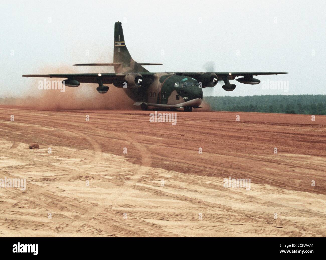 1979 - A C-123 Provider aircraft lands on an unimproved runway during Exercise VOLANT RODEO '79. Stock Photo