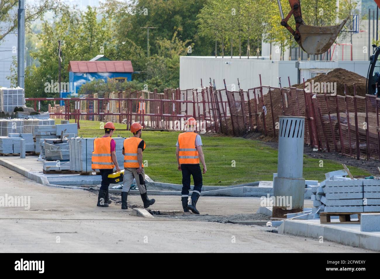 Construction workers wearing orange hi-res stock photography and images ...