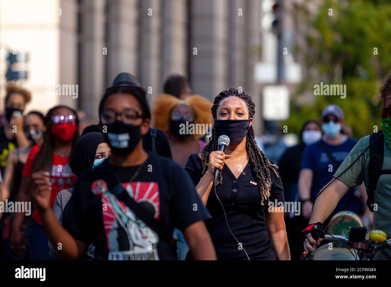 Washington, DC, USA, September 7, 2020. Pictured: A protester leads the crowd in singing as they walk down 14th Street en route to Freedom Plaza during Let Freedom Sing, a community-building protest and voter registration event by the Freedom Day Foundation and Head Count. Credit: Allison C Bailey/Alamy Credit: Allison Bailey/Alamy Live News Stock Photo