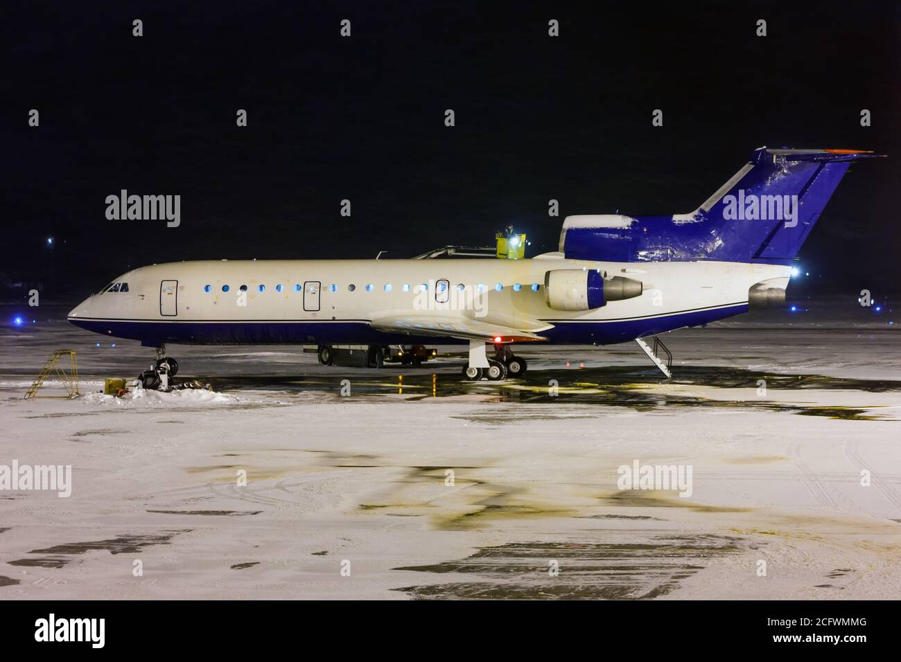 Deicing plane processing in the night airport Stock Photo Alamy