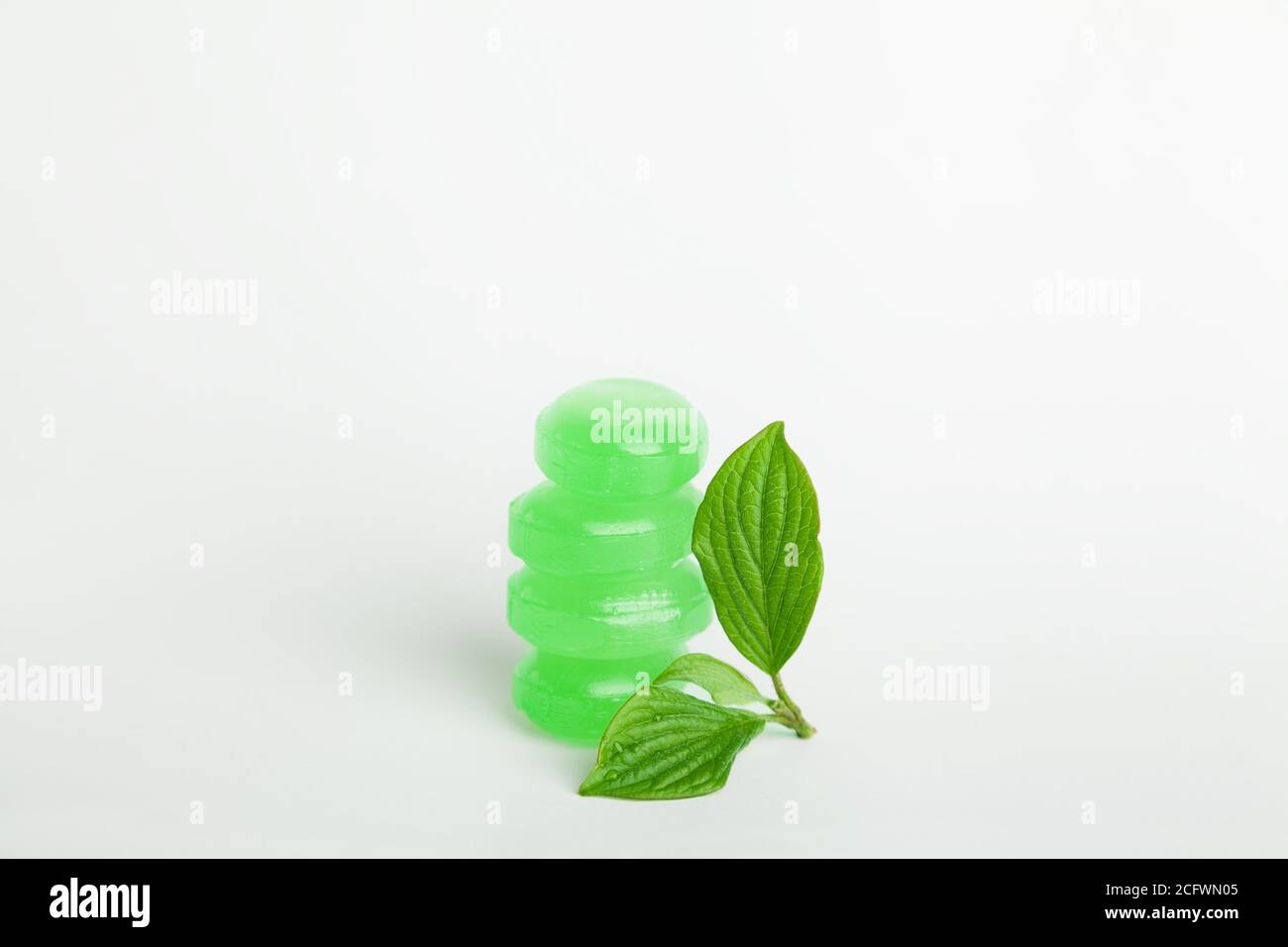 Cough lozenges with mint green leaves Stock Photo Alamy