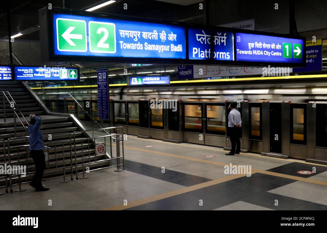 New Delhi, India. 07th Sep, 2020. Delhi Metro Rail Corporation (DMRC) worker is seen on stand by to guide passengers as they travel in Delhi Metro on the first day of its reopening after 5 months lockdown due to Covid-19.On the first day, the yellow line between HUDA City Centre and Samaypur Badli, will run from 7 to 11 am, and 4 to 8 pm in the 2nd phase. The metro will resume full services from September 12. Credit: SOPA Images Limited/Alamy Live News Stock Photo