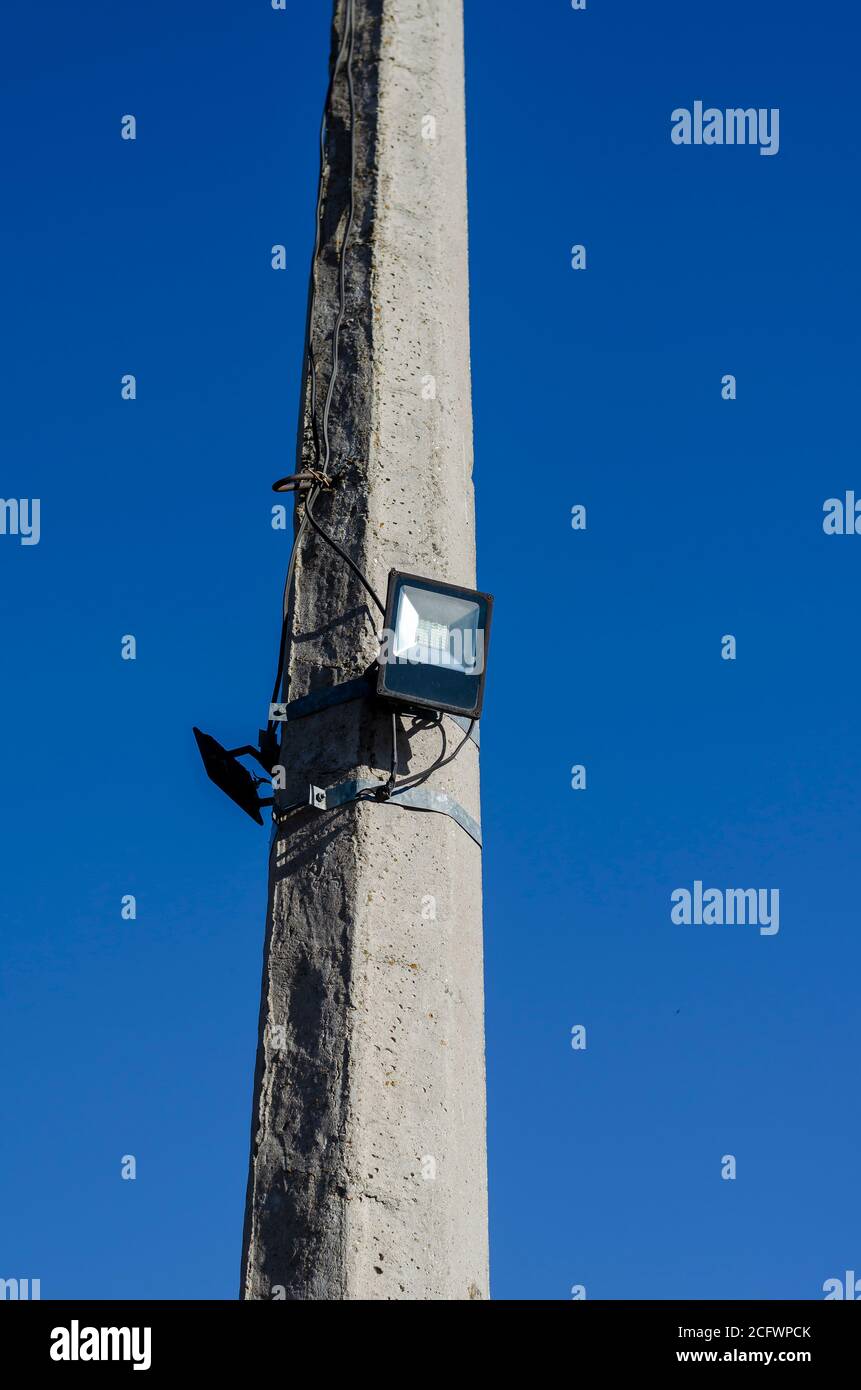 Concrete pole with LED spotlight. Using energy efficient technologies