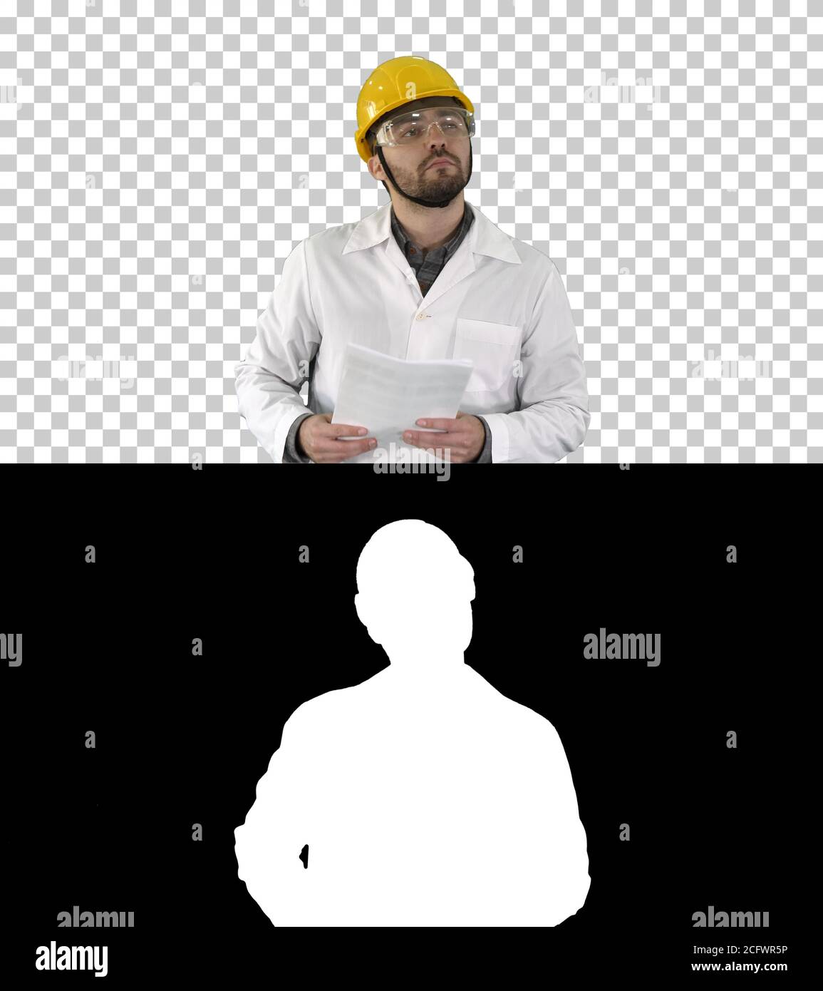 Site engineer cheching papers and something around him, Alpha Channel Stock Photo