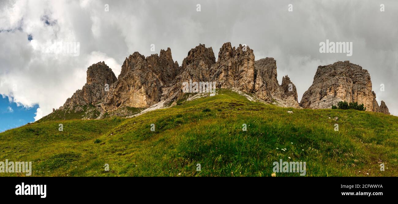 Panorama of the Cir group with grass in the foreground, Dolomites - Trentino-Alto Adige, Italy Stock Photo