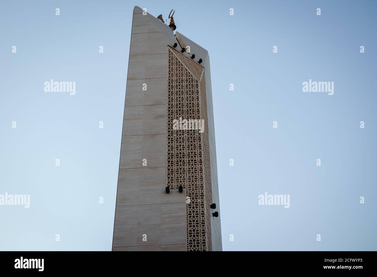 Islamic Mosque Minaret tower, Modern design with sunrise background. Stock Photo