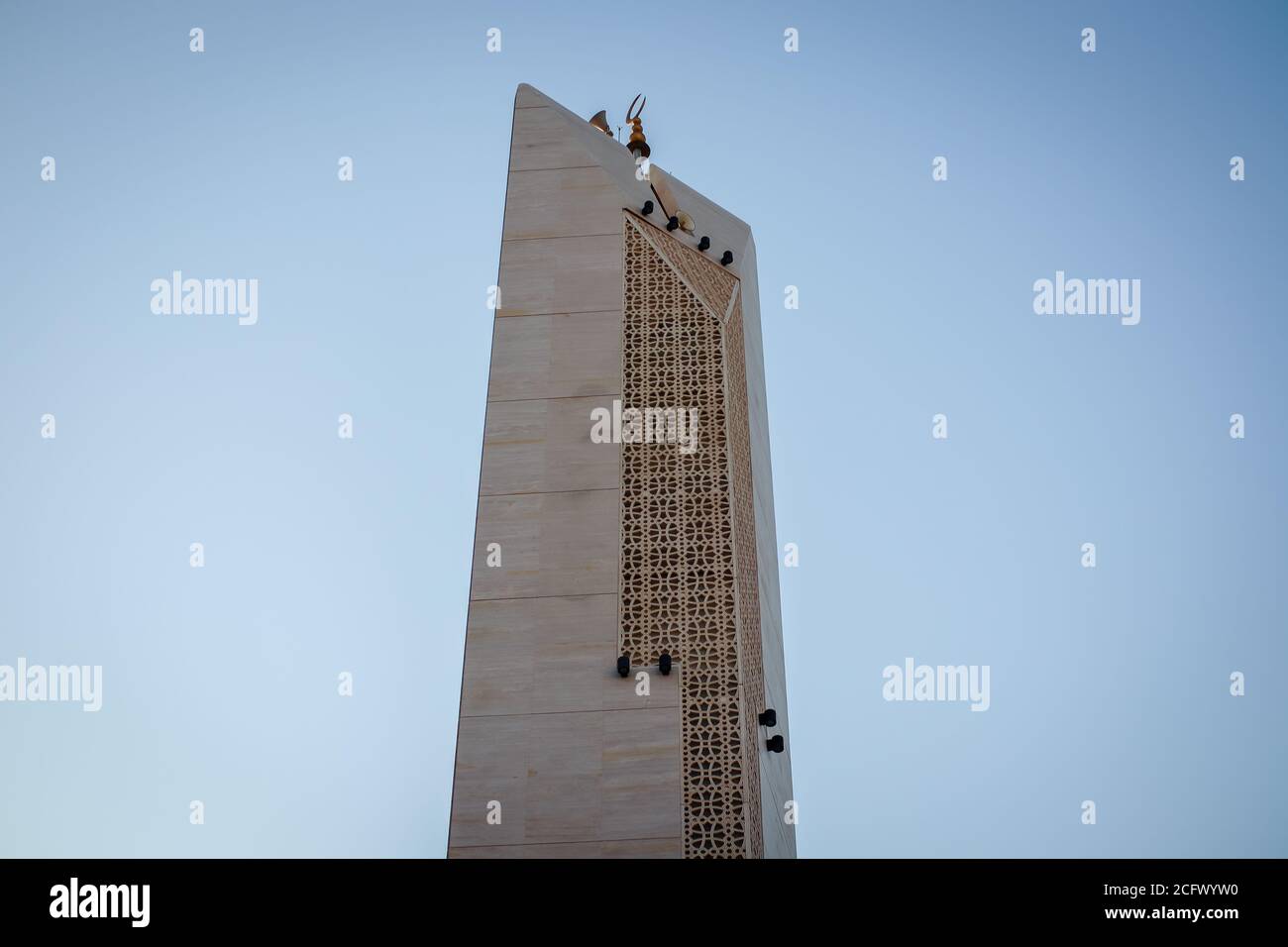 Islamic Mosque Minaret tower, Modern design with sunrise background. Stock Photo