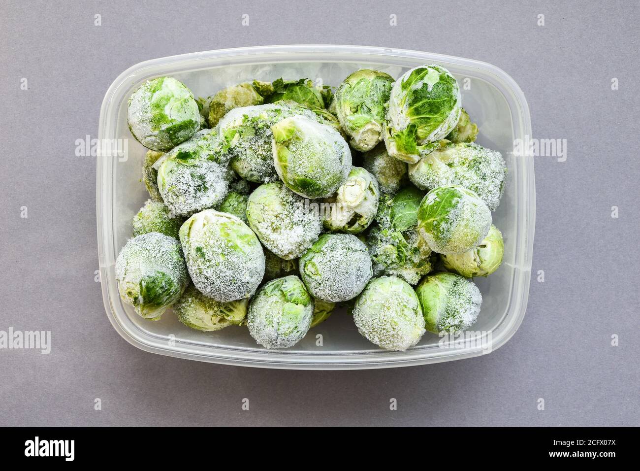 Frozen brussels sprouts in a plastic container for longterm storage