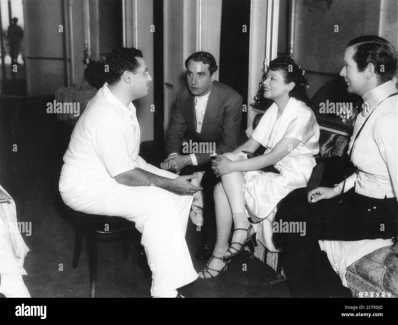 GEORGE CUKOR HENRY DANIELL LENORE ULRIC and REX O'MALLEY on set candid  during filming of CAMILLE 1936 director GEORGE CUKOR novel / play Alexandre  Dumas fils Metro Goldwyn Mayer Stock Photo - Alamy