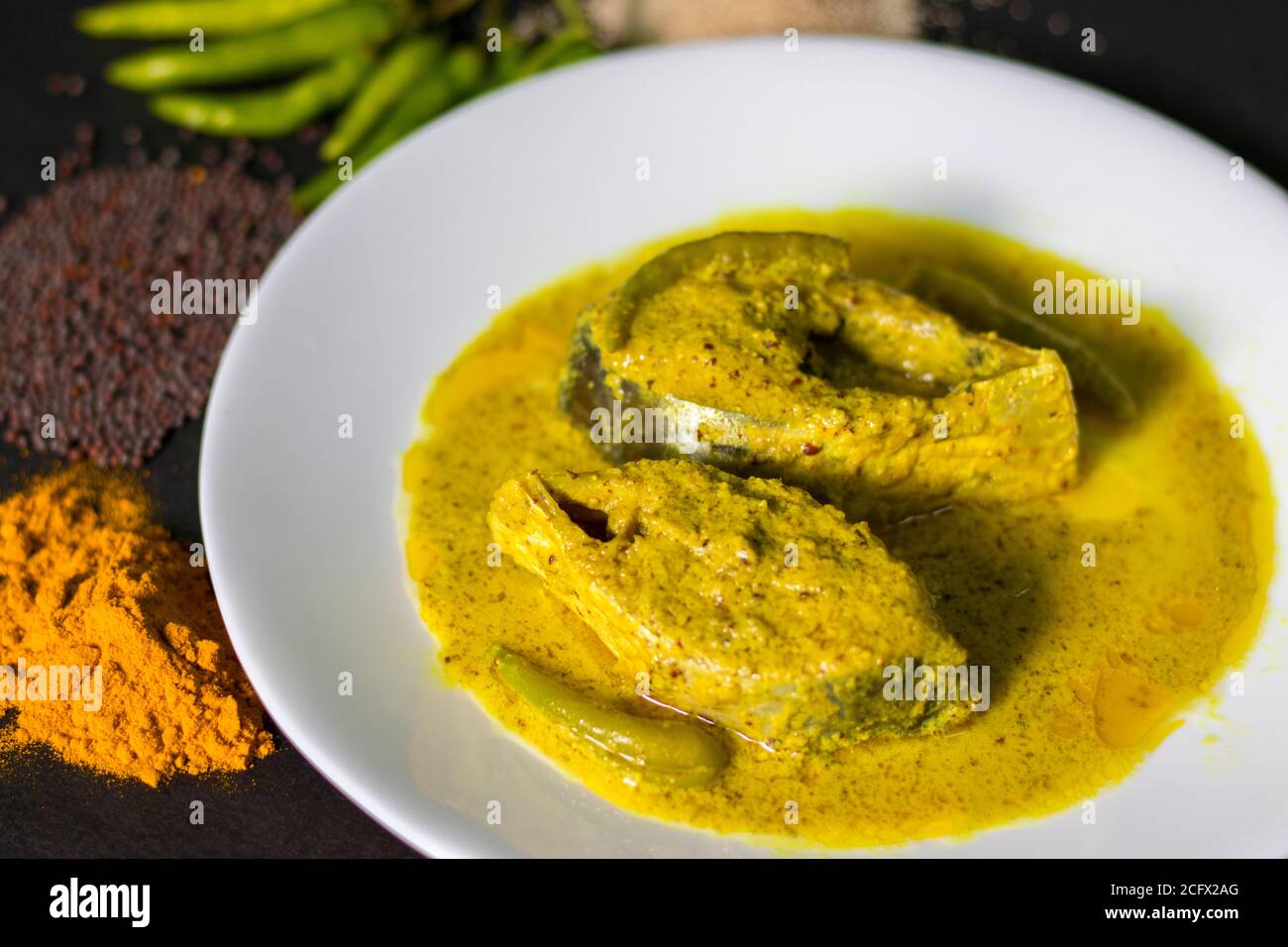 Famous Bengali Dish Hilsa/Ilish fish with poppy and mustard seed recipe. Stock Photo
