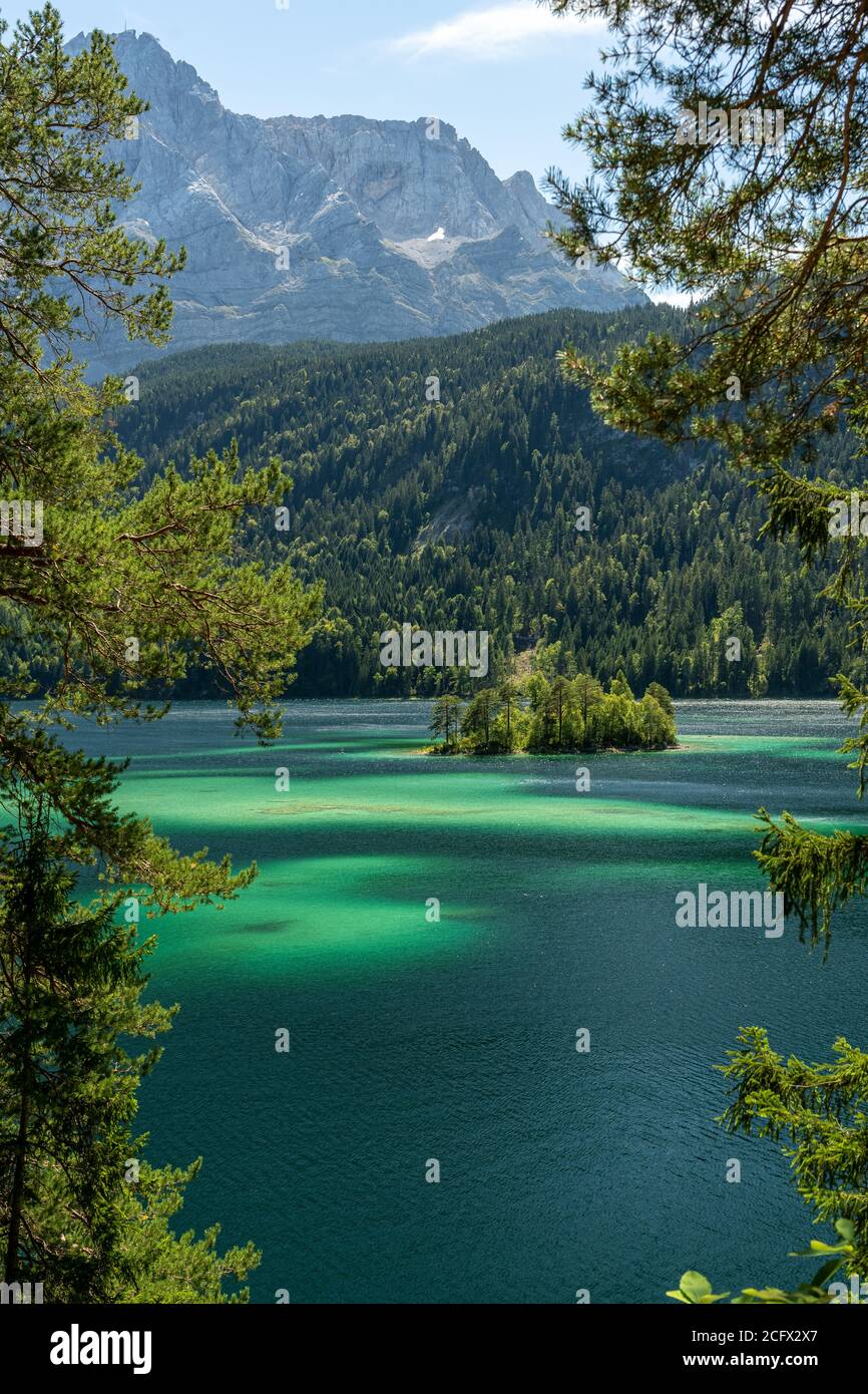 view on beautiful island in the eibsee in front of the zugspitze ...