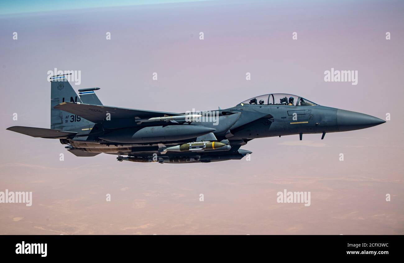 A U.S. Air Force F-15E Strike Eagle flies over the U.S. Central Command area of responsibility, Sept 4, 2020.  The F-15E Strike Eagle is a dual-role fighter designed to perform air-to-air and air-to-ground missions, demonstrating U.S. Air Force Central Commands' posture to compete, deter and win against state and non-state actors.  (U.S. Air Force photo by Senior Airman Duncan C. Bevan) Stock Photo
