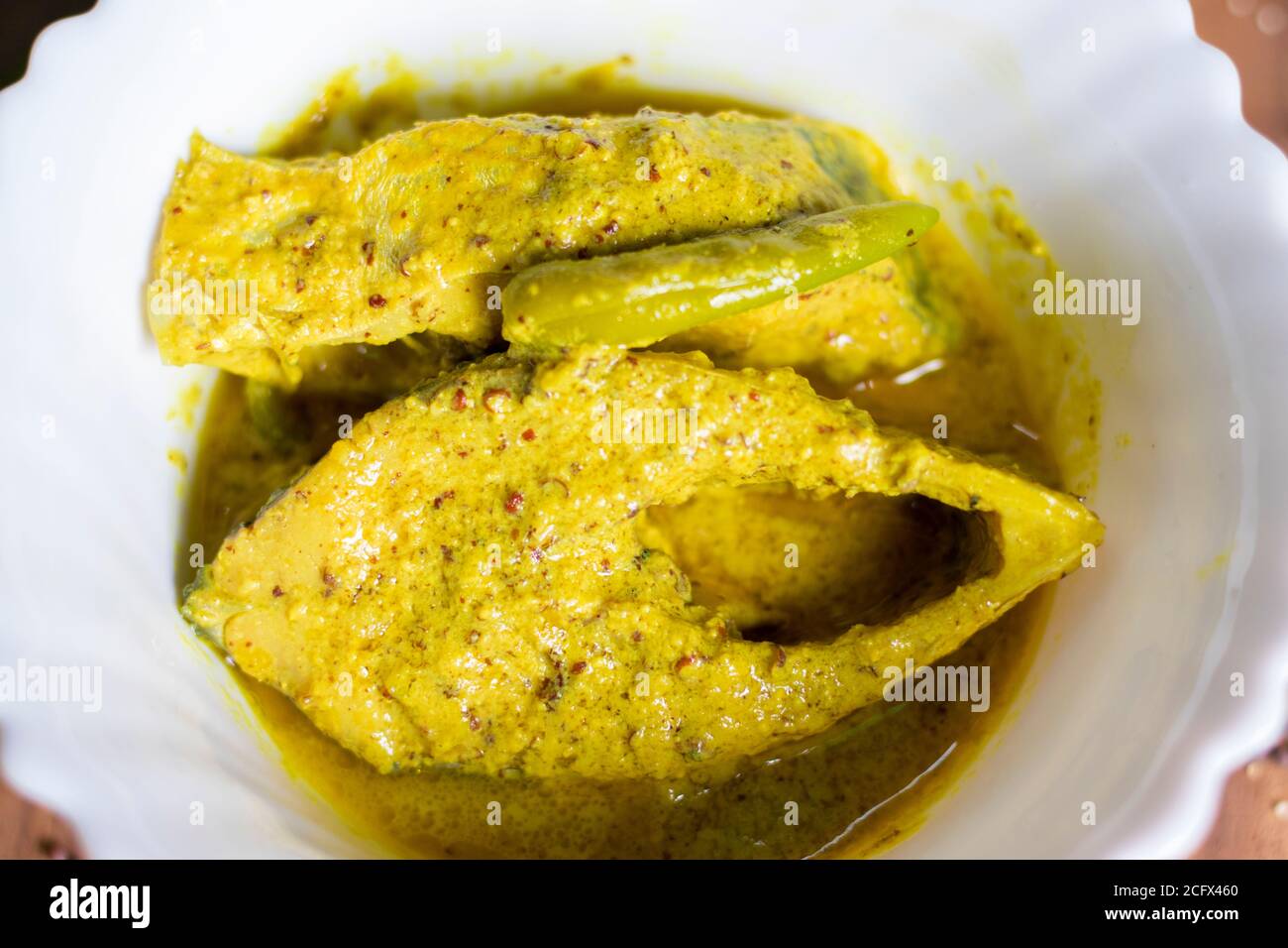 Famous Bengali Dish Hilsa/Ilish fish with poppy and mustard seed recipe. Stock Photo