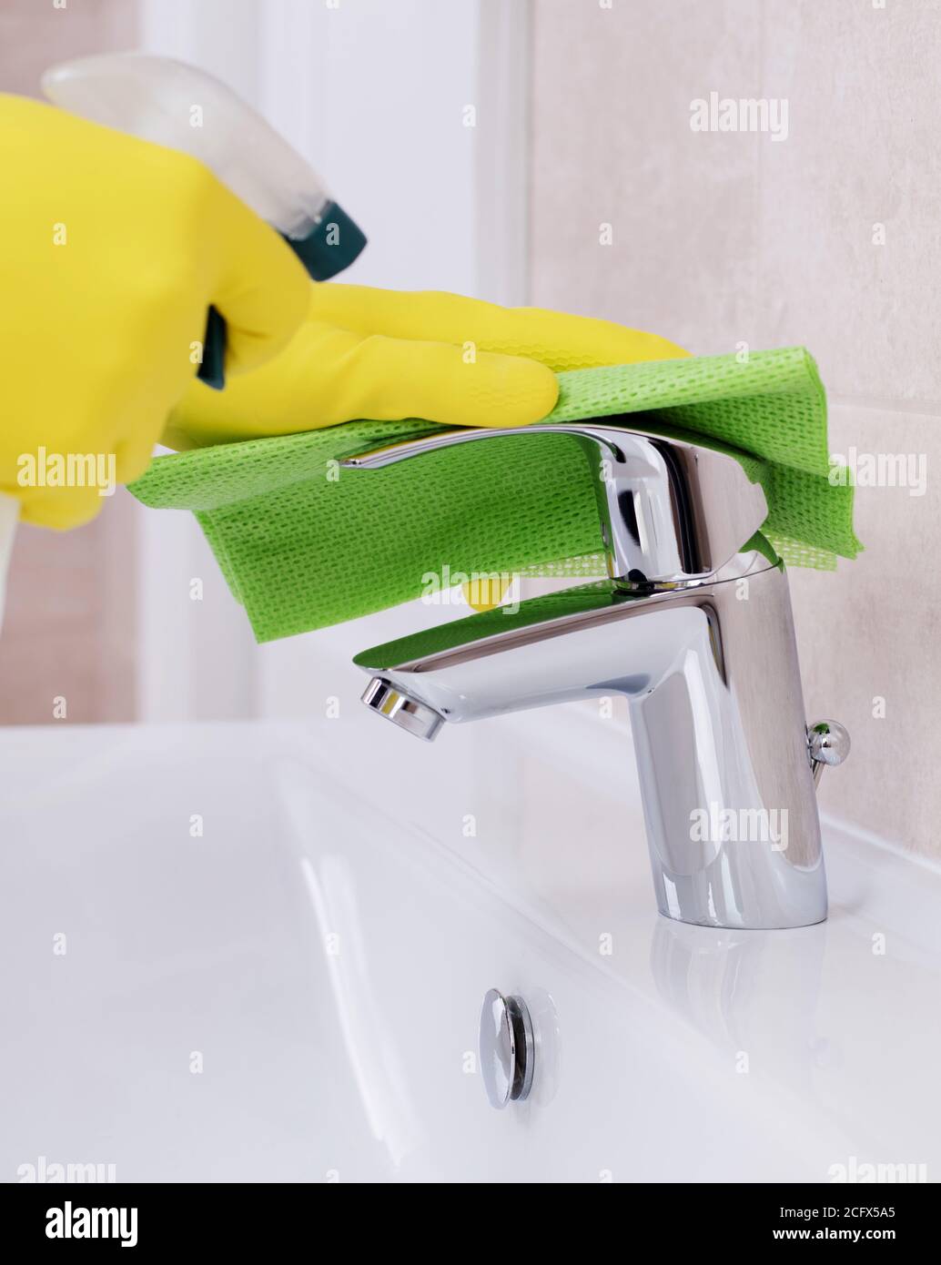 Cleaning the water tap Stock Photo Alamy