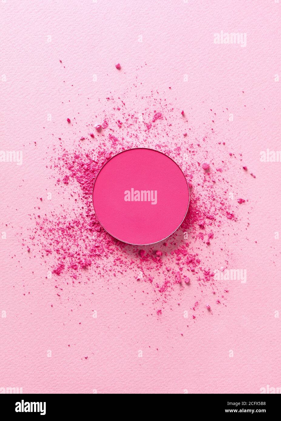 Crushed face powder on pink background Stock Photo - Alamy