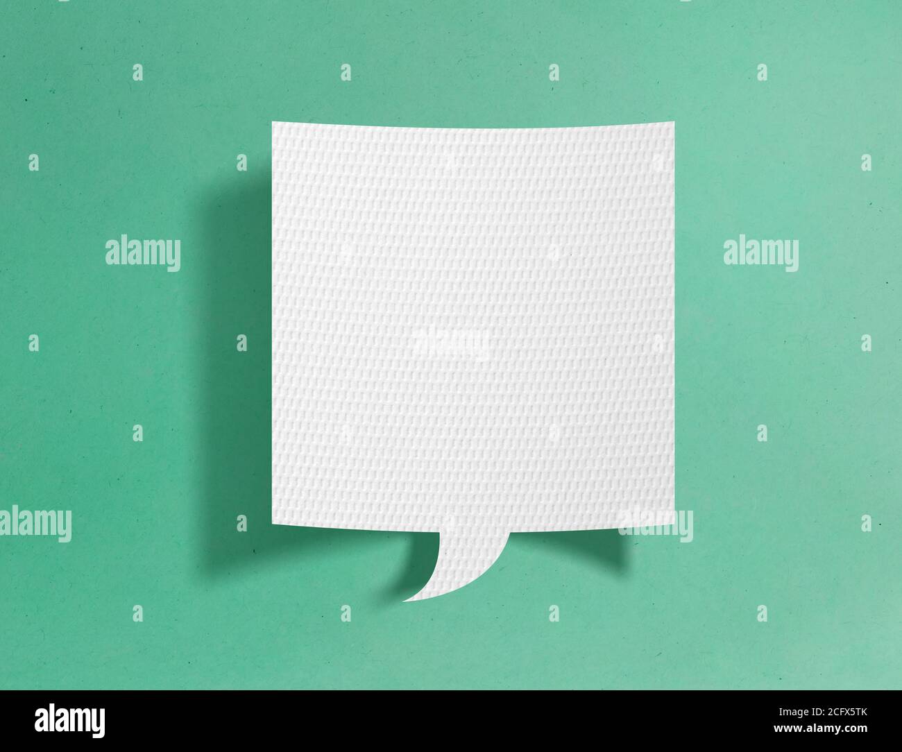Speech bubble on green background Stock Photo - Alamy