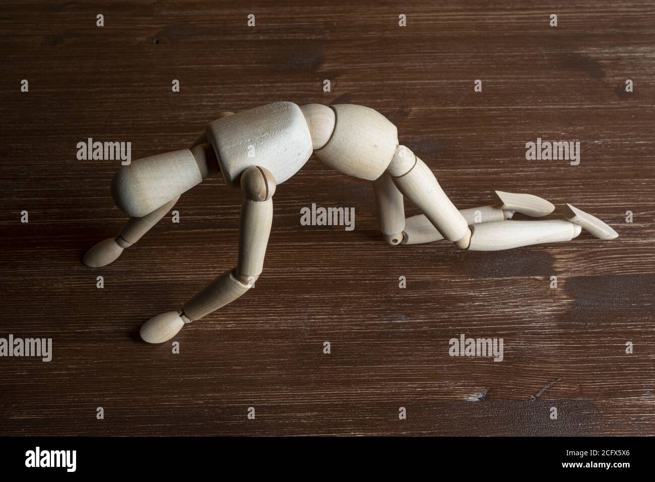 a wooden dummy as he stands up Stock Photo