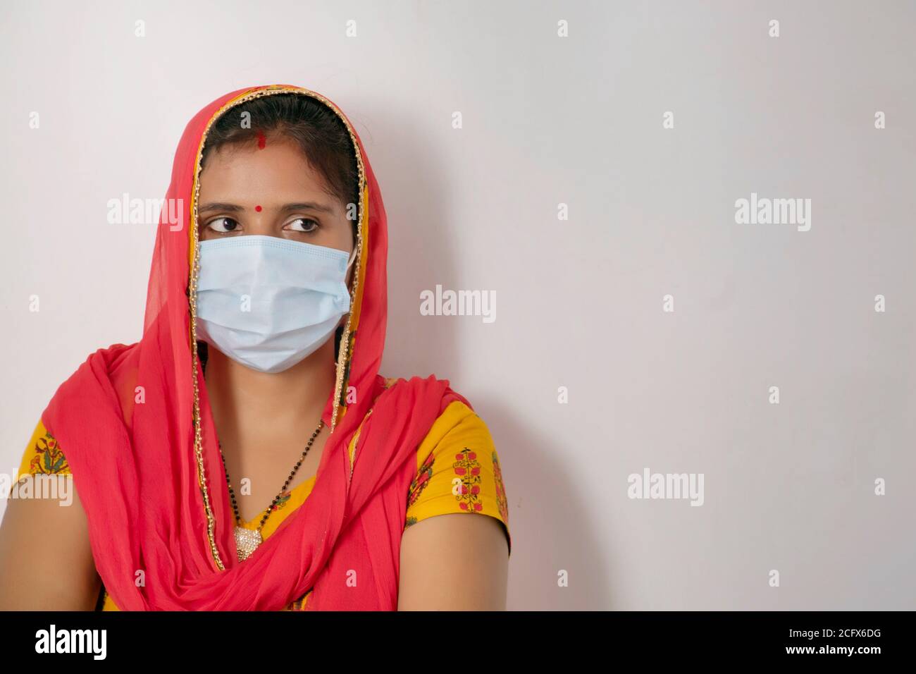 Indian woman wearing mask Stock Photo