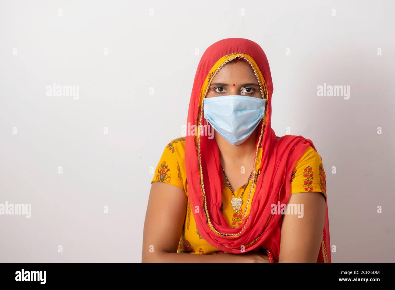 Indian woman wearing mask Stock Photo