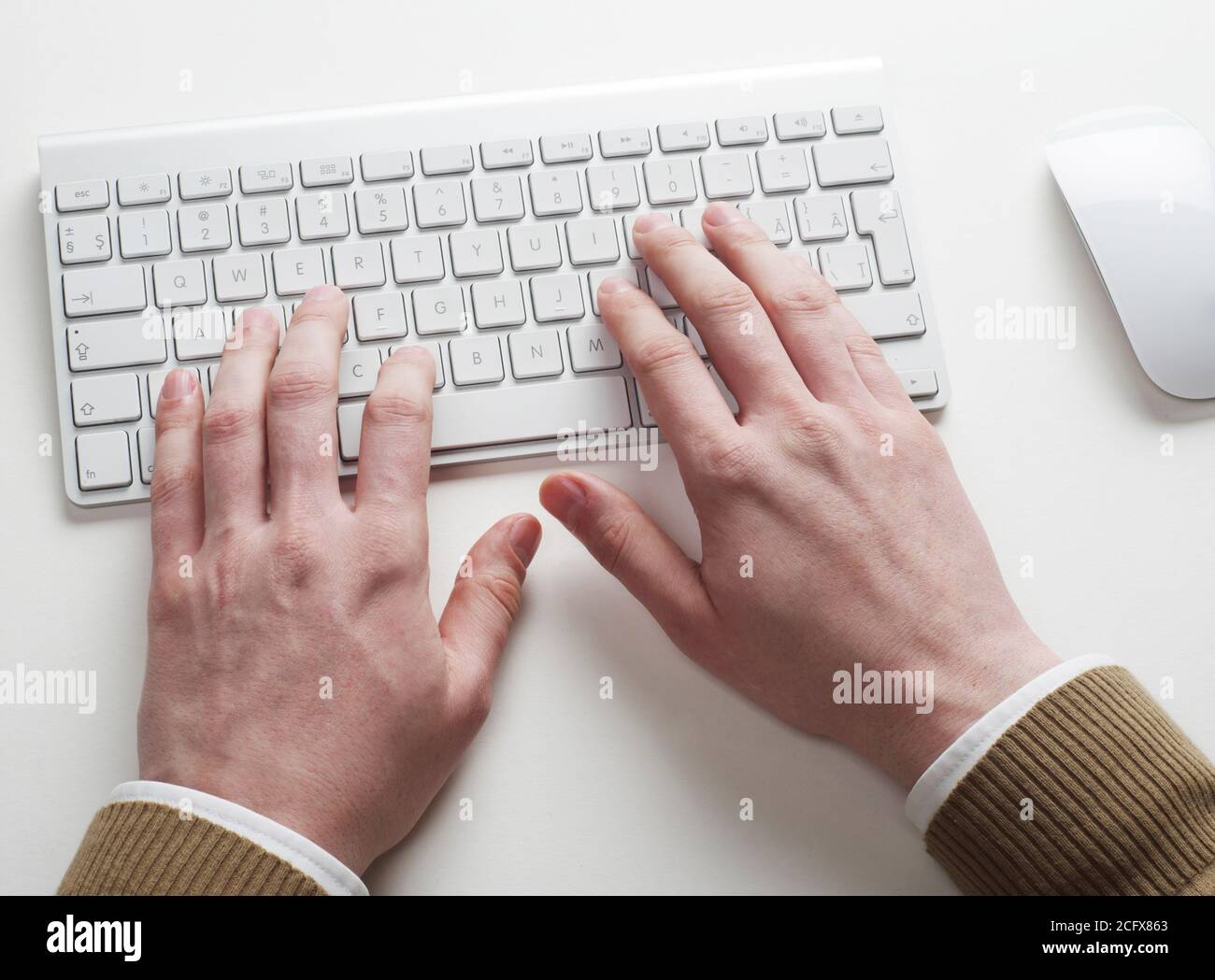 Man typing on computer keyboard Stock Photo - Alamy
