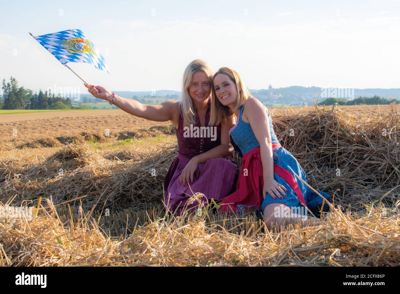 Two bavarian friends with the flag having fun Stock Photo
