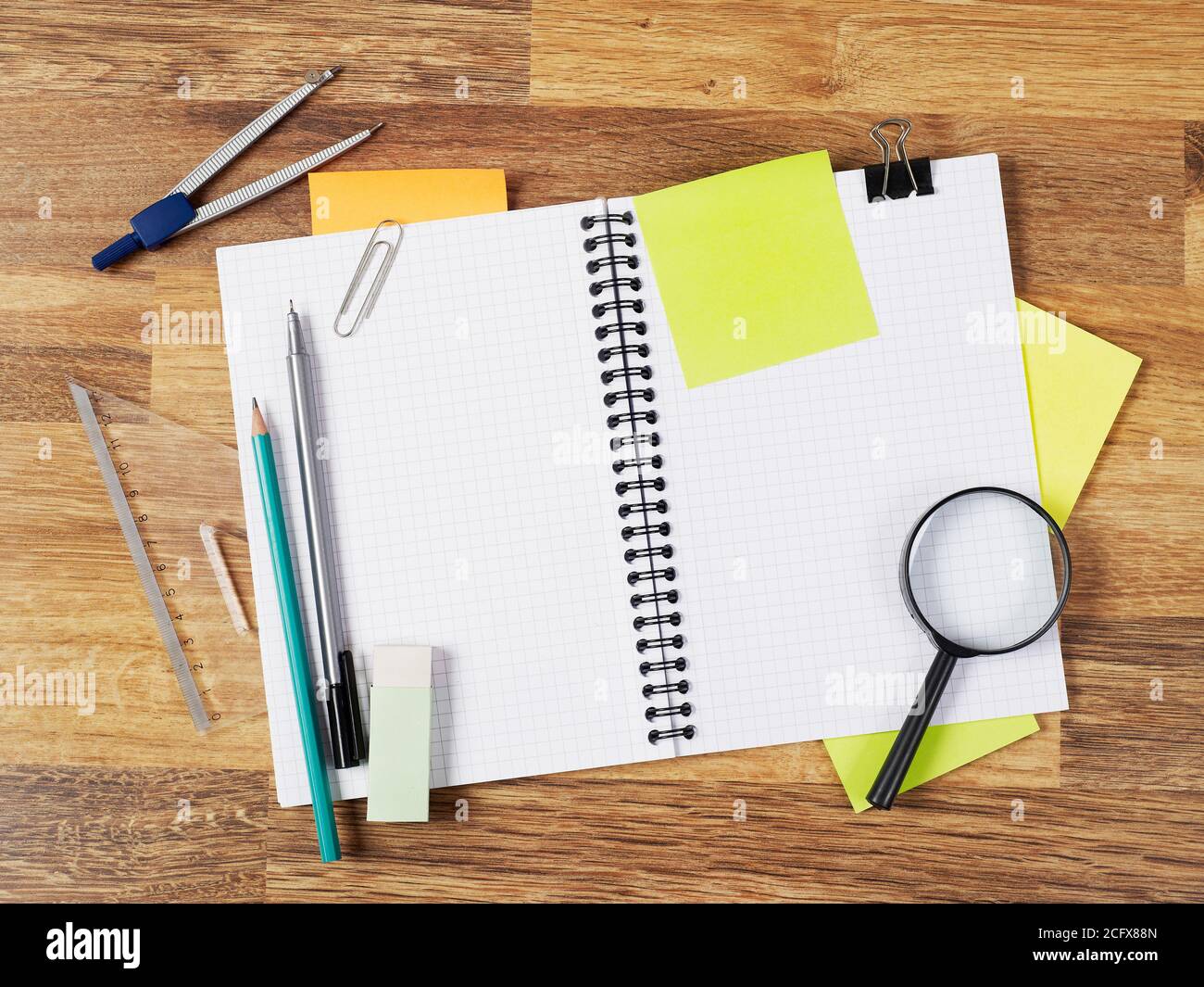Blank notebook with supplies on white Stock Photo