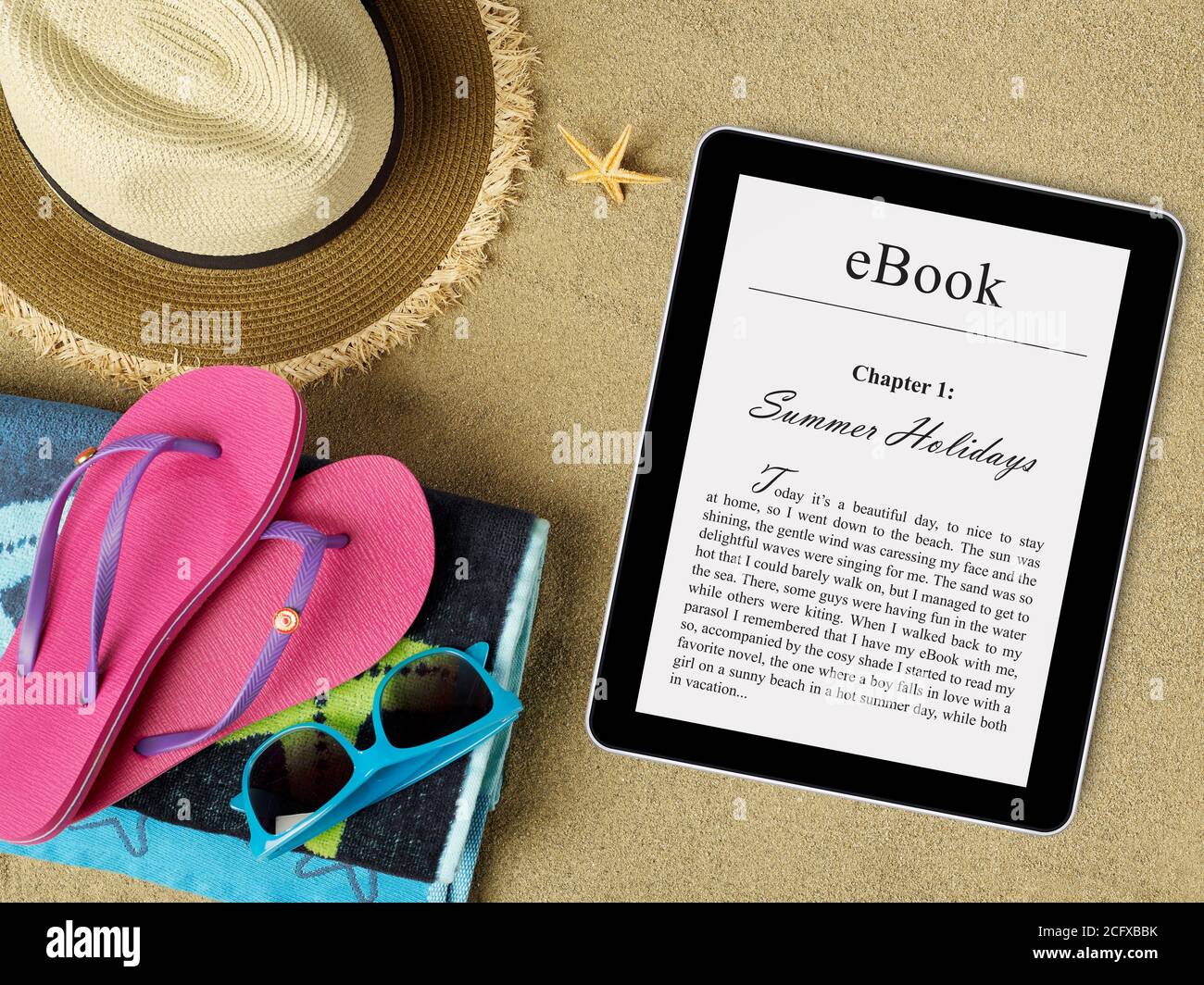 eBook tablet on beach Stock Photo