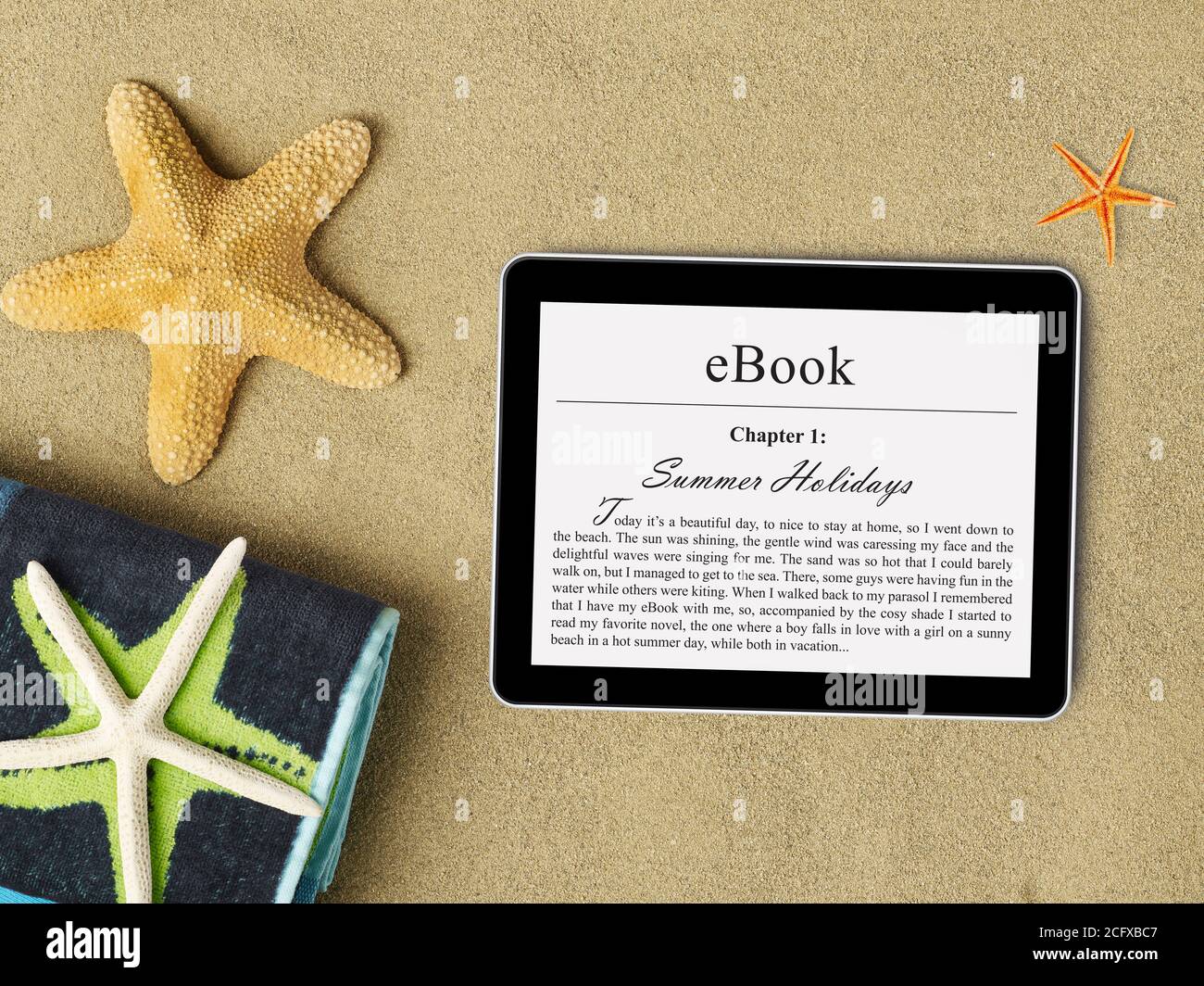 eBook tablet on beach Stock Photo