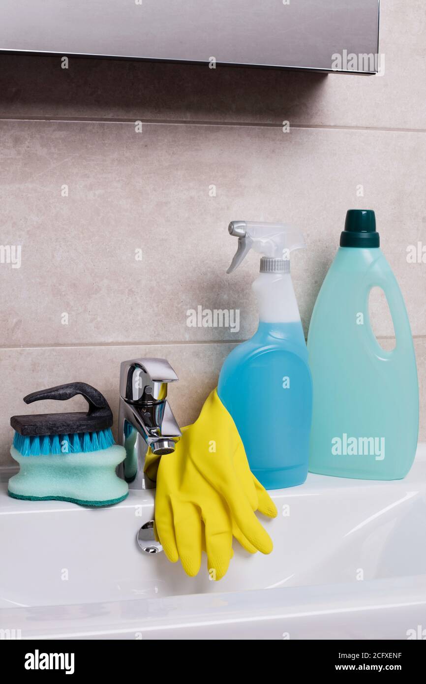 Cleaning equipment on bathroom sink Stock Photo - Alamy