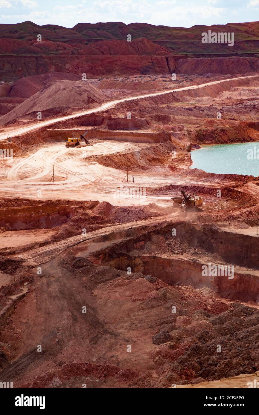 Bauxite open cast (open cut) mining. Color aluminium ore quarry. Blue
