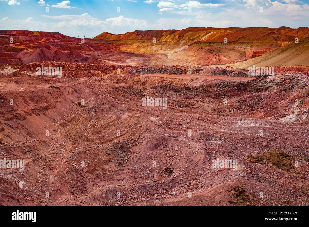 Aluminium ore quarry. Bauxite clay opencut mining. Color heaps of