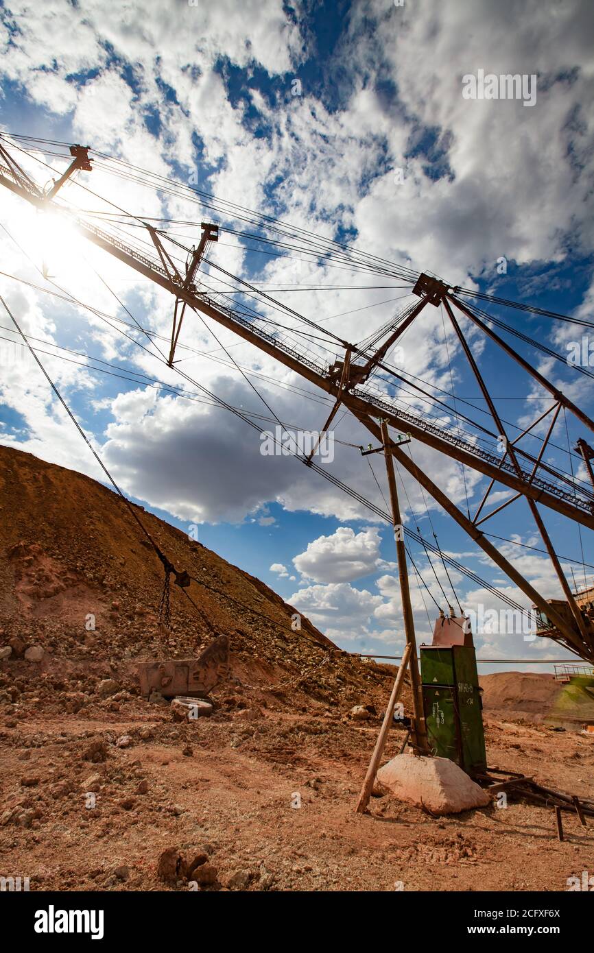 Aluminium ore quarry. Bauxite clay opencut mining. Heavy walking