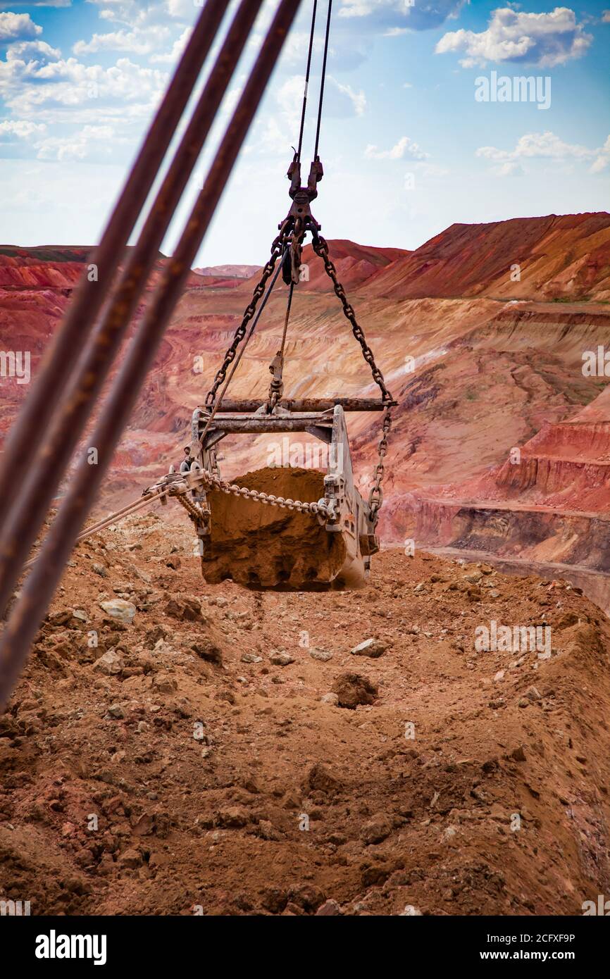 Aluminium ore quarry. Red bauxite clay opencut mining. Walking