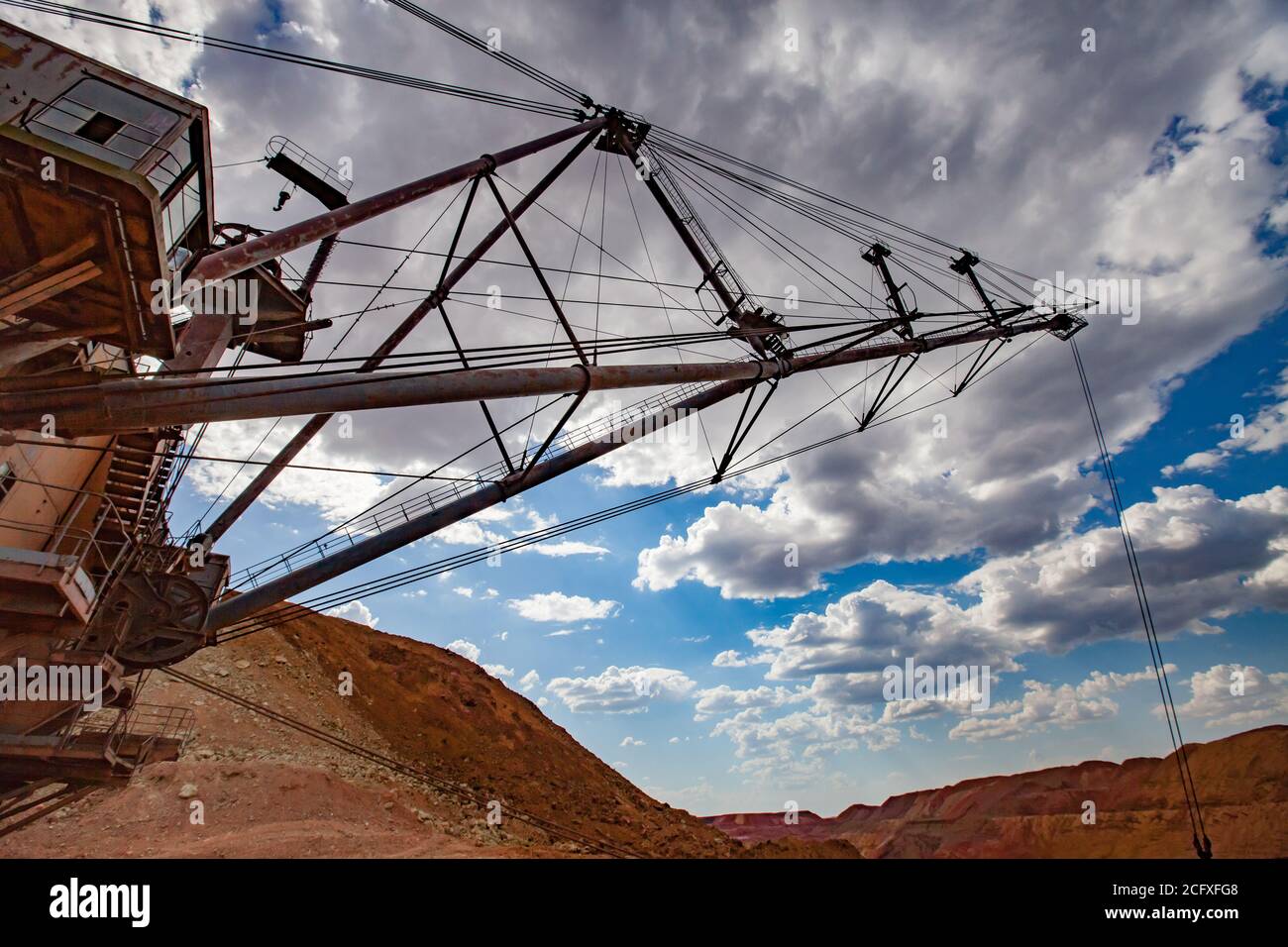 Aluminium ore quarry. Bauxite clay opencut mining. Walking dragline