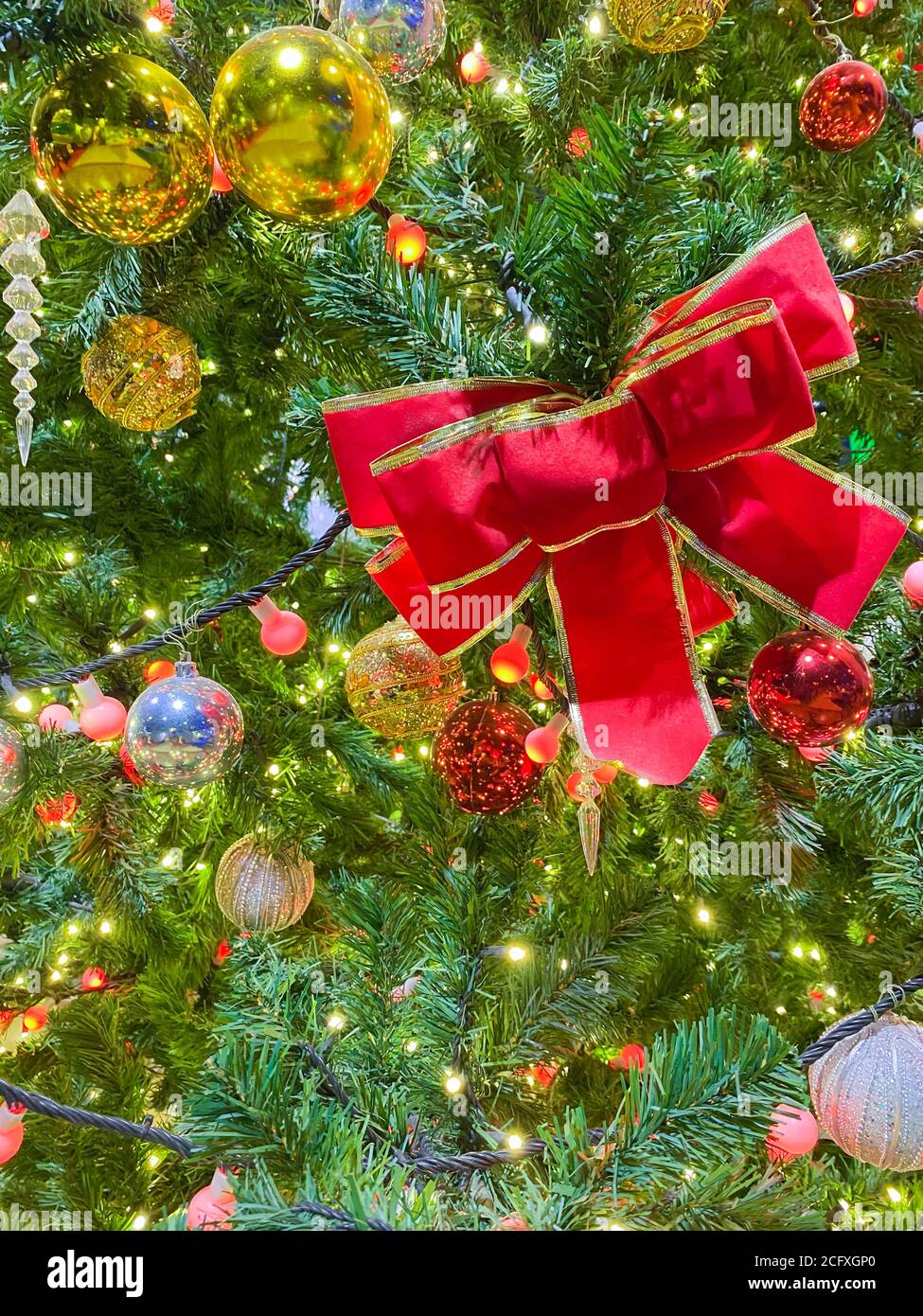 Christmas background with decorated christmas tree on blurred, sparkling and fairy background. Stock Photo