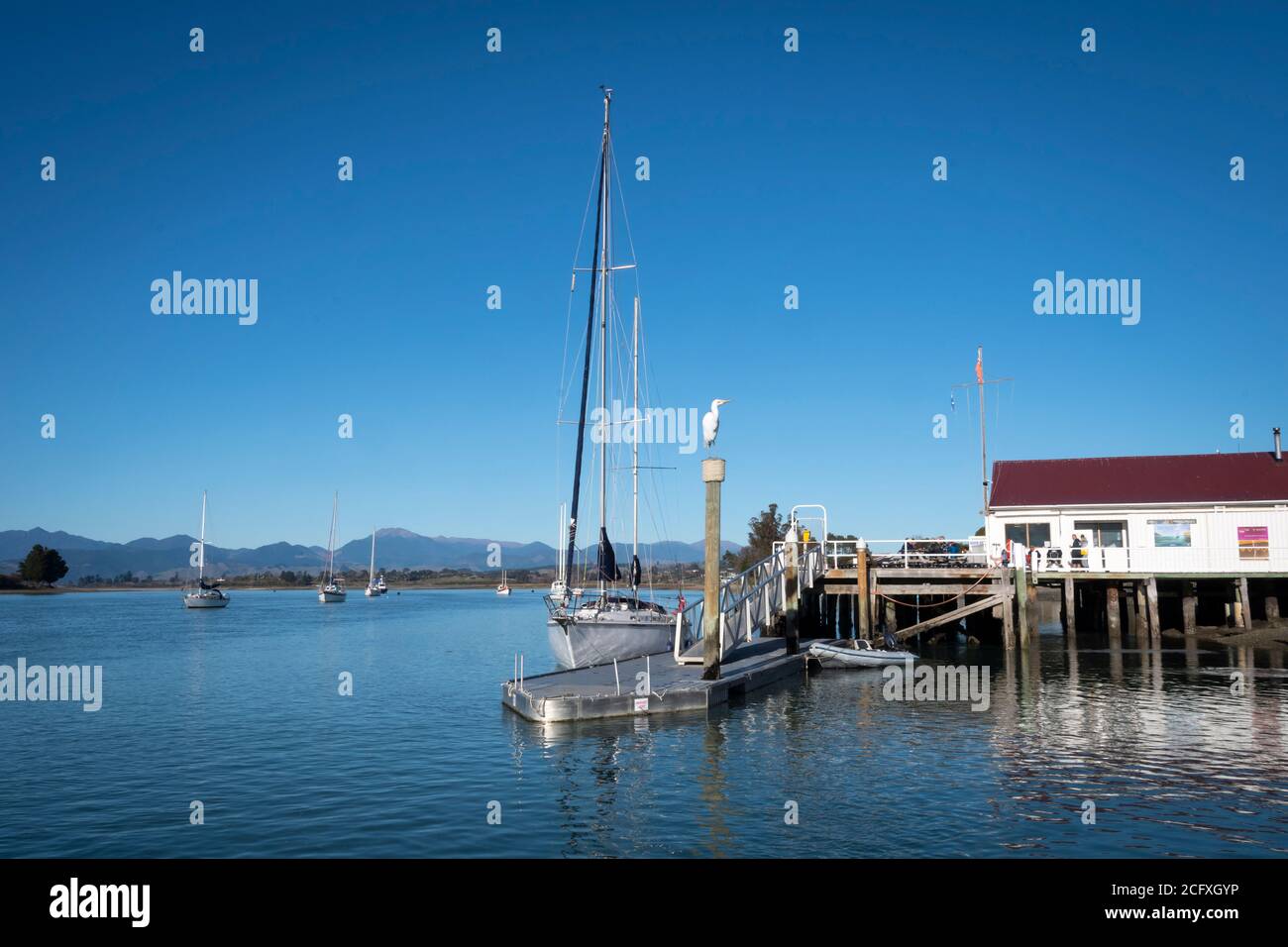 Boats and wharf at Mapua, Nelson, South Island, New Zealand Stock Photo