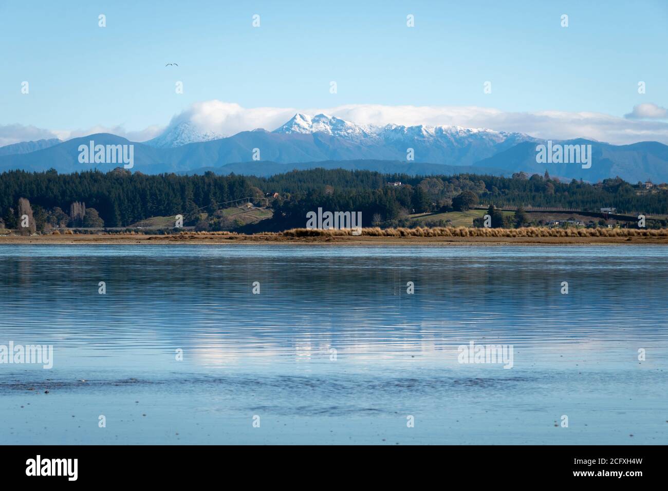 Waimea Inlet with snow capped Mount Arthur Range in distance, Mapua