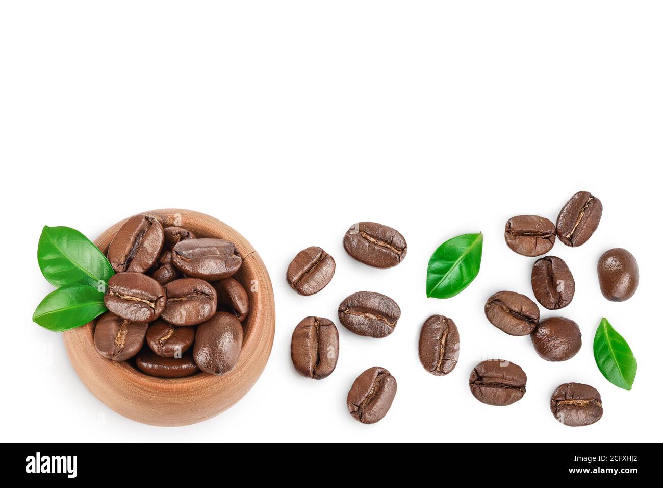 Heap of roasted coffee beans with leaves isolated on white background ...