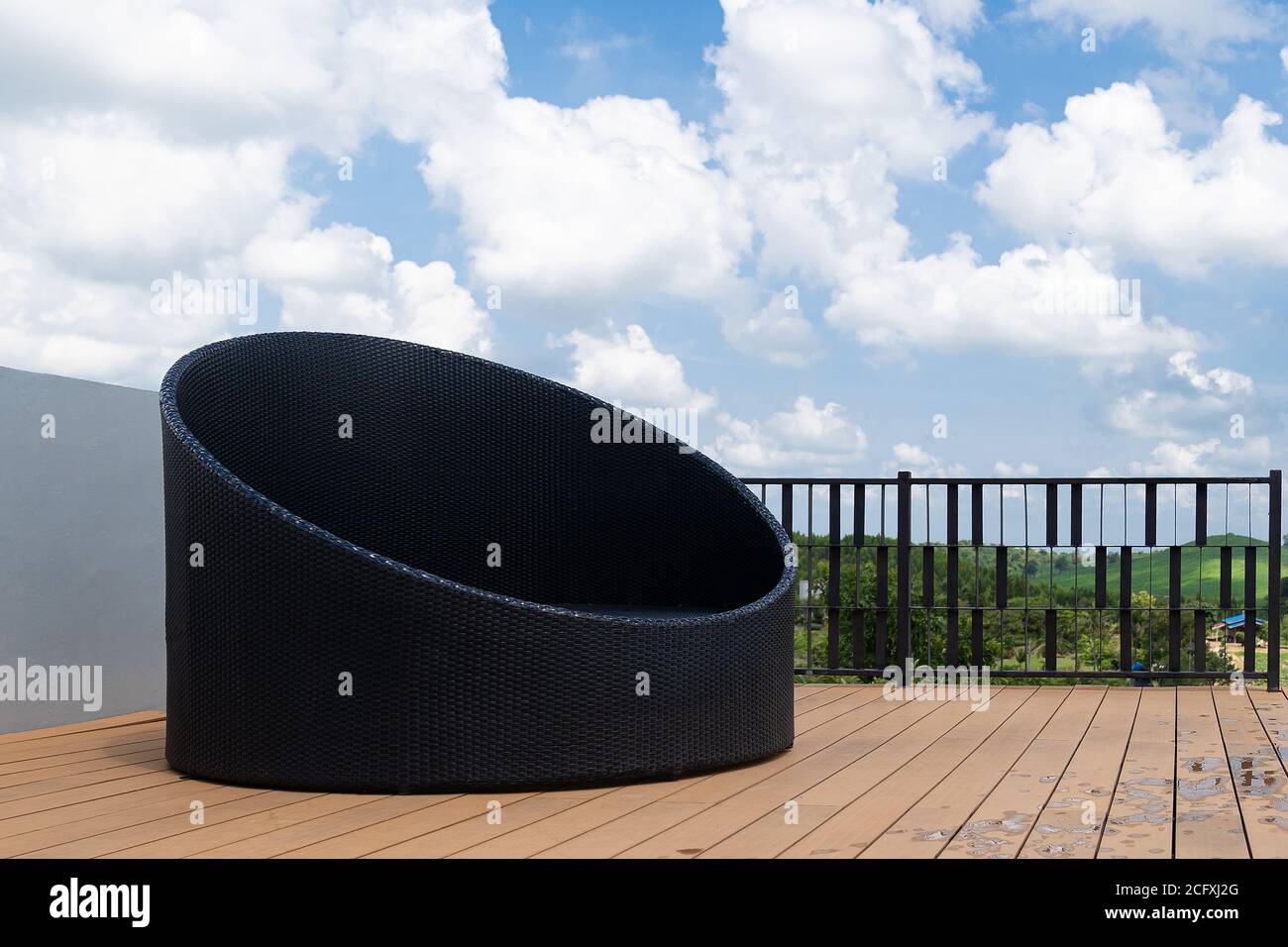 Relax corner with modern black sofa on rooftop luxury resort, blue sky ...