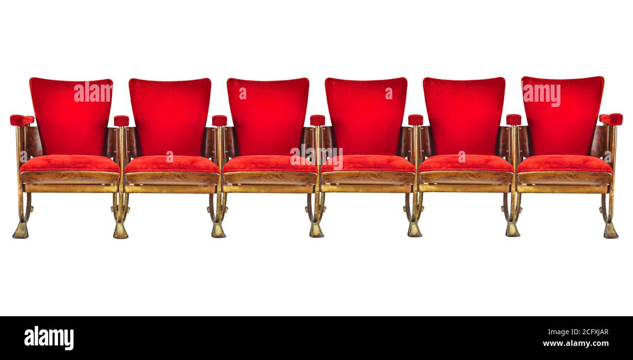Row of six red vintage cinema chairs isolated on a white background Stock Photo
