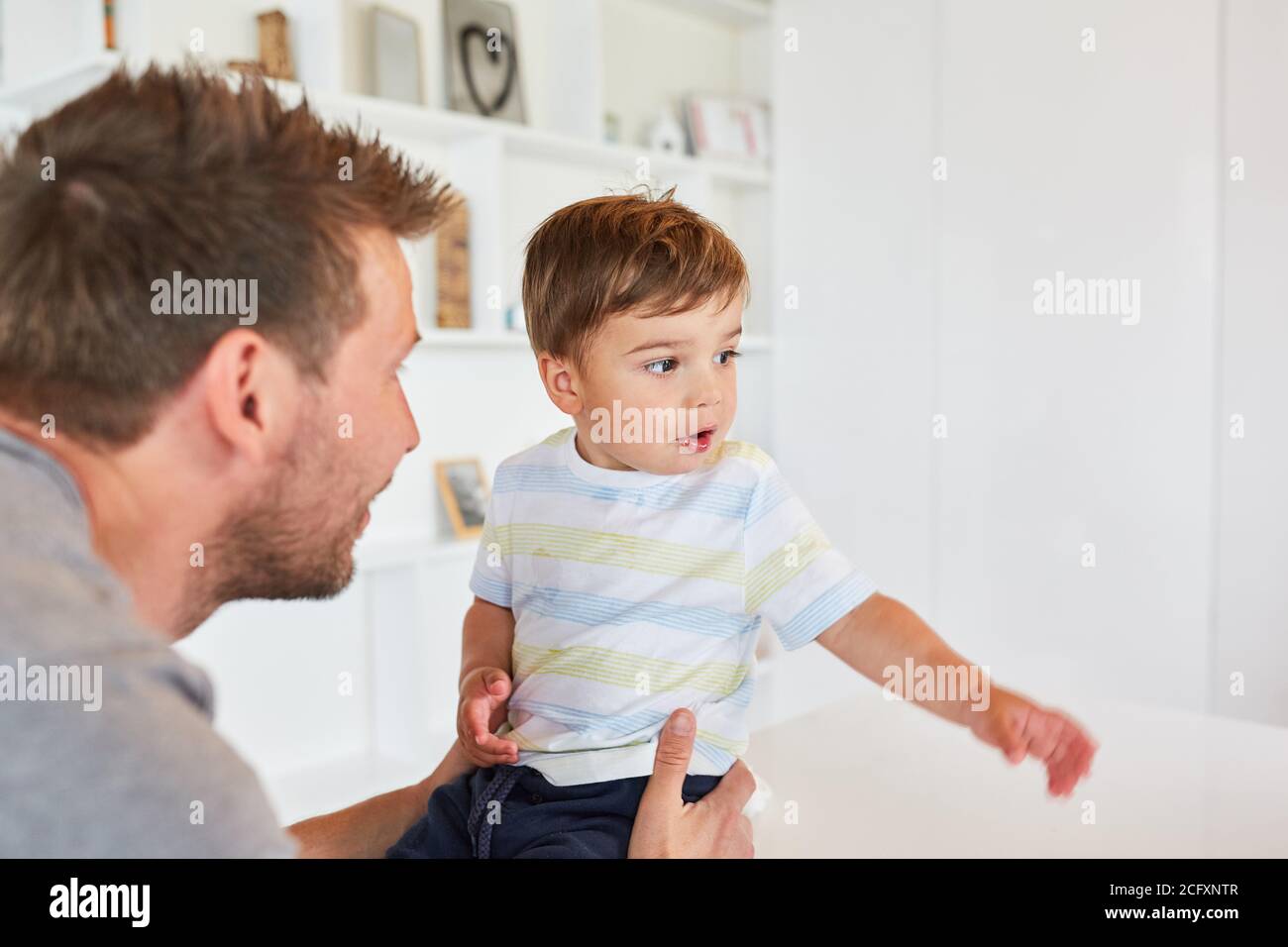 Single father and son at home as a love and responsibility concept Stock Photo