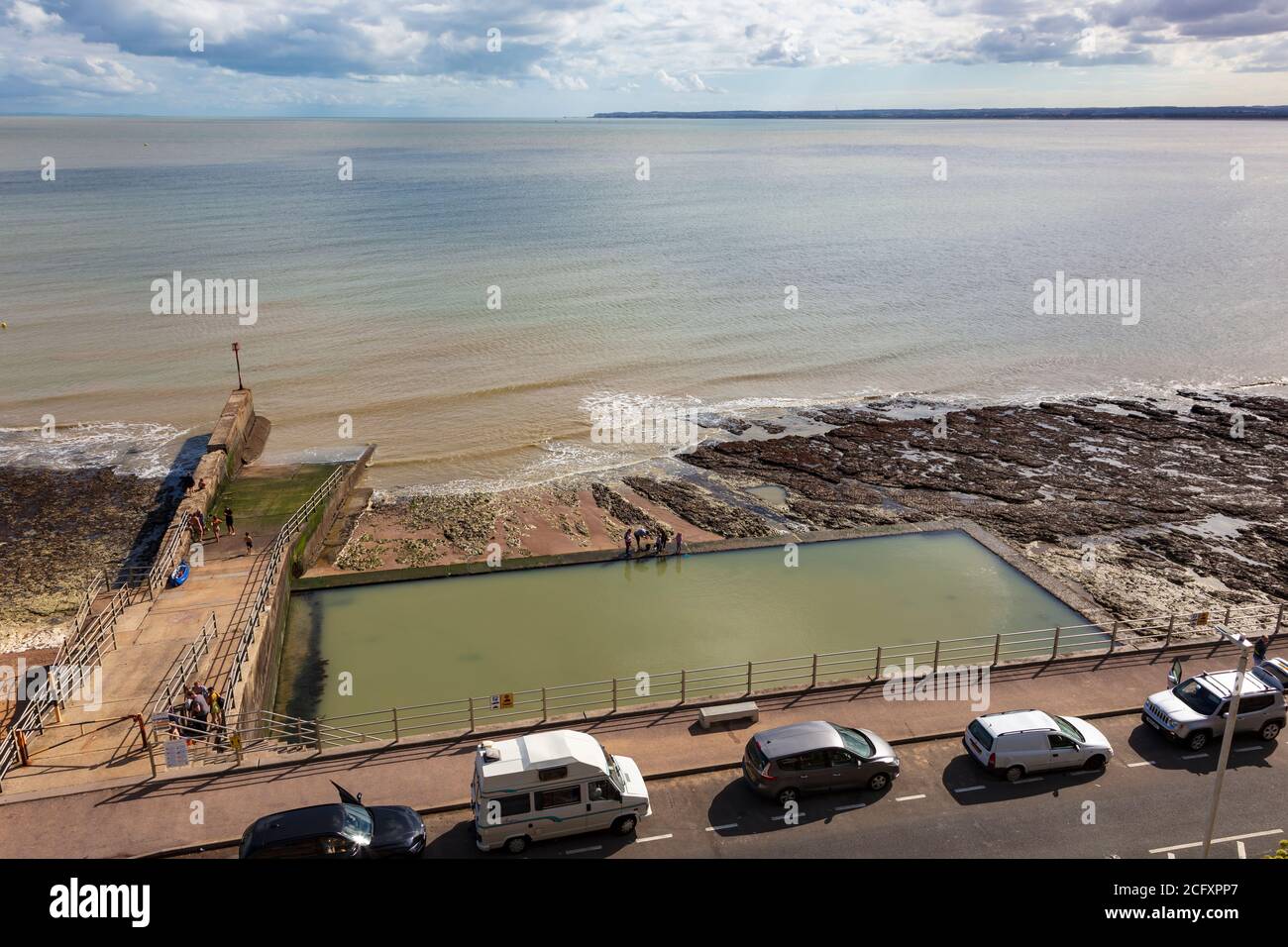 Sea Paddling pool on August Bank Holiday on a hot day around Ramsgate Royal Harbour, Kent, UK Stock Photo