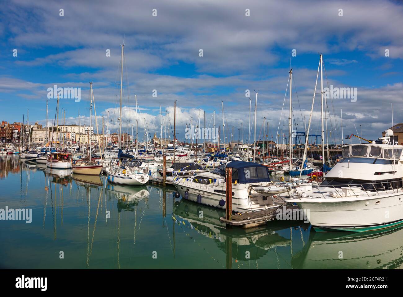 August Bank Holiday on a hot day around Ramsgate Royal Harbour, with moored yachts and boats,Kent, UK Stock Photo