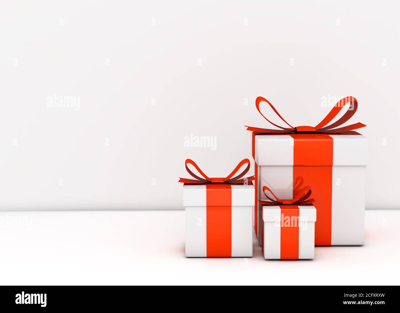 Gift boxes and empty white wall Stock Photo