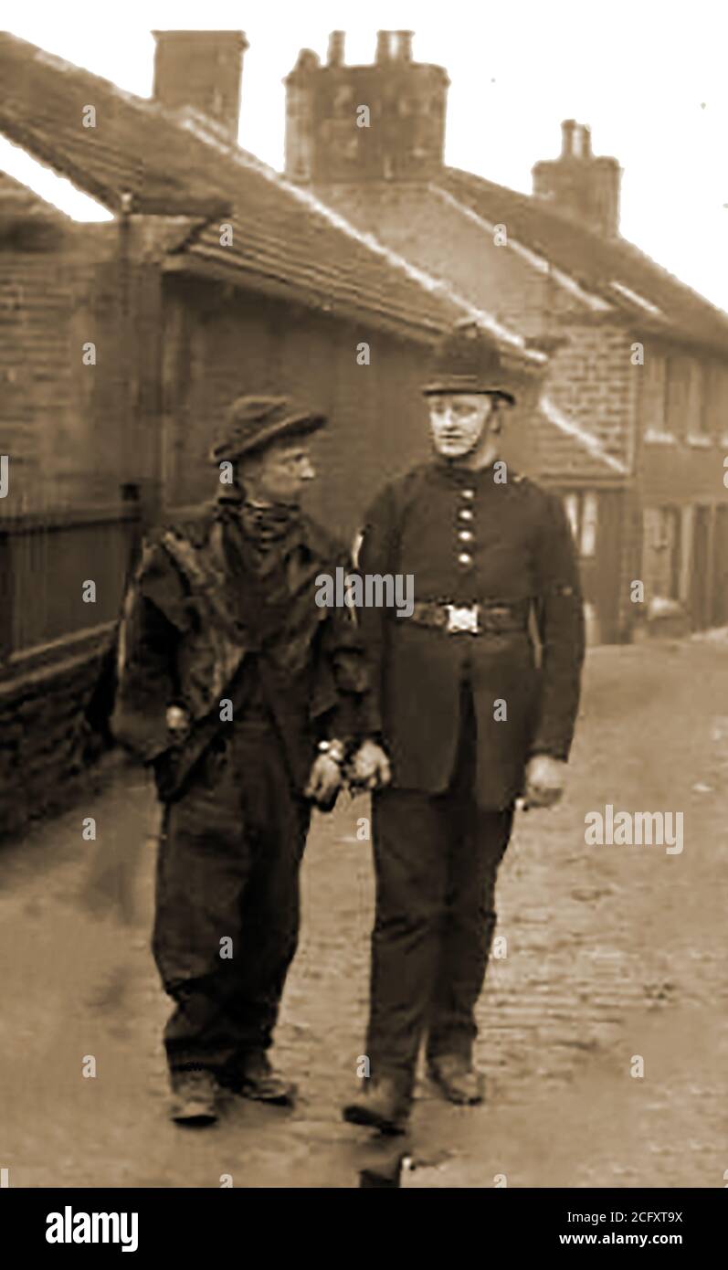 Circa 1910 - A British 'Bobby' (policeman), handcuffed to the man he has just arrested.British home minister, Sir Robert Peel (1778-1850), created London’s first organised police force. Before Peel’s 1829 reforms, public order had been maintained by  night watchmen, local constables and red  coated army soldiers. The new officers became known as Bobbies or Peelers in reference to Robert Peel. Today's a UK police officer has  a number of nicknames including, rozzer, bizzie, the bill,cop,copper,dibble,fuzz, (and others,sometimes more derogatory) Stock Photo